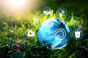 Circular economy concept with icons representing recycling, manufacturing, shopping disposal. 