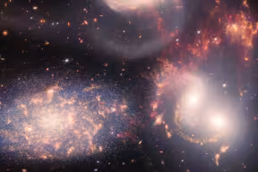 Image of Stephan's Quintet (a group of five galaxies) composed from JWST data using the Near-Infrared Camera (NIRCam) and Mid-Infrared Instrument (MIRI). One of the galaxies in the group is one of the active galaxies studied in this work. 