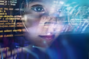 Close up of a little girl looking at some futuristic holograms.