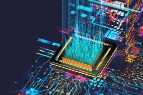 Artistic concept of quantum computing showing a futuristic chip with illuminated digital data streaming upwards from it.