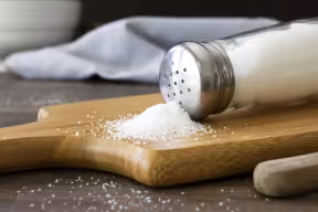 Salt on wooden chopping board