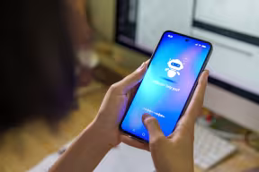 Teen using chatbot on mobile phone. Credit: Thai Liang Lim, Getty Images