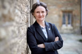 Professor Irene Tracey stands in front of a wall