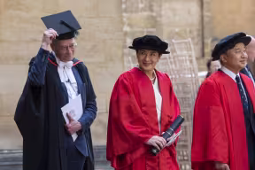 Image shows Emperor Naruhito and Empress Masako in ceremonial robes for a special ceremony where Empress Masako was given an honorary degree by the University