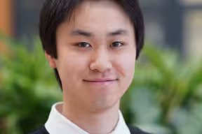 Oxford Student, Justin Xu smiling at the camera