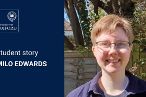 Student story: Milo Edwards. An image of Milo outside, smiling towards the viewer. Milo wears glasses and has short strawberry-blond hair.
