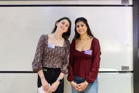 Rhiannon Savage and Nikita Handel at the Women and Non-Binary People in Mathematics Day Conference