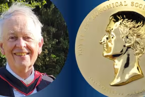  Left: A white male, with grey hair, wearing a ceremonial academic gown. Right: A gold medal with the profile of a man’s face- it is Sir Isaac Newton. It is inscribed with 'ROYAL ASTRONOMICAL SOCIETY INST: MDCCCXX.', ' NUBEM PELLENTE MATHESI' 'NEWTON'. 