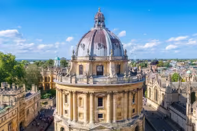 An aerial image of the Radcliffe Camera, an ornate cylindrical building in Oxford topped with a dome. Image credit: Shutterstock.