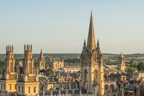 The Oxford skyline at sunset, showing All Souls College and the University Church in the foreground