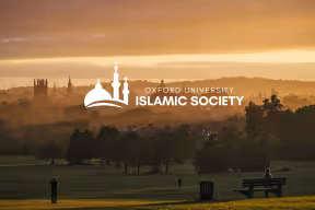 A sunset Oxford skyline from South Park with the Oxford University Islamic Society logo 