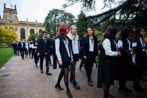 Students lined up in sub-fusc outside Trinity College