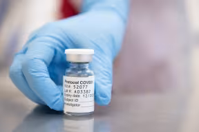 Photo | Nurse reaching for a ChAdOx1 vaccine vial