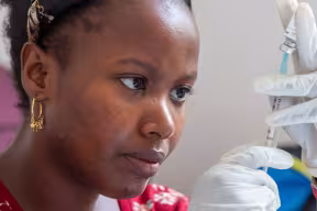 African doctor and malaria vaccine
