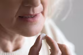 RECOVERY trial participant takes antibiotic