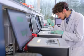 Nanopore scientist with gridion technology and pipette