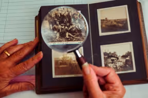 Photograph album with a magnifying glass