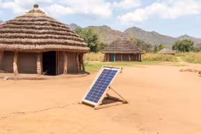 Solar panel providing electricity to dwellings in rural Africa
