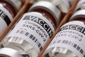 Photo | Dummy vaccine vials in a rack