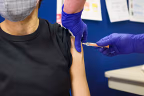Woman receiving the COVID-19 vaccine