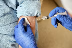 90 year-old woman receiving a vaccine