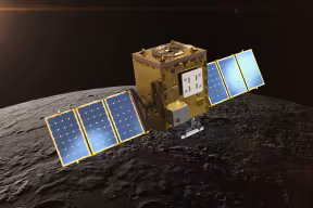 A spacecraft shaped like a box with two arms in orbit above the Moon's surface.