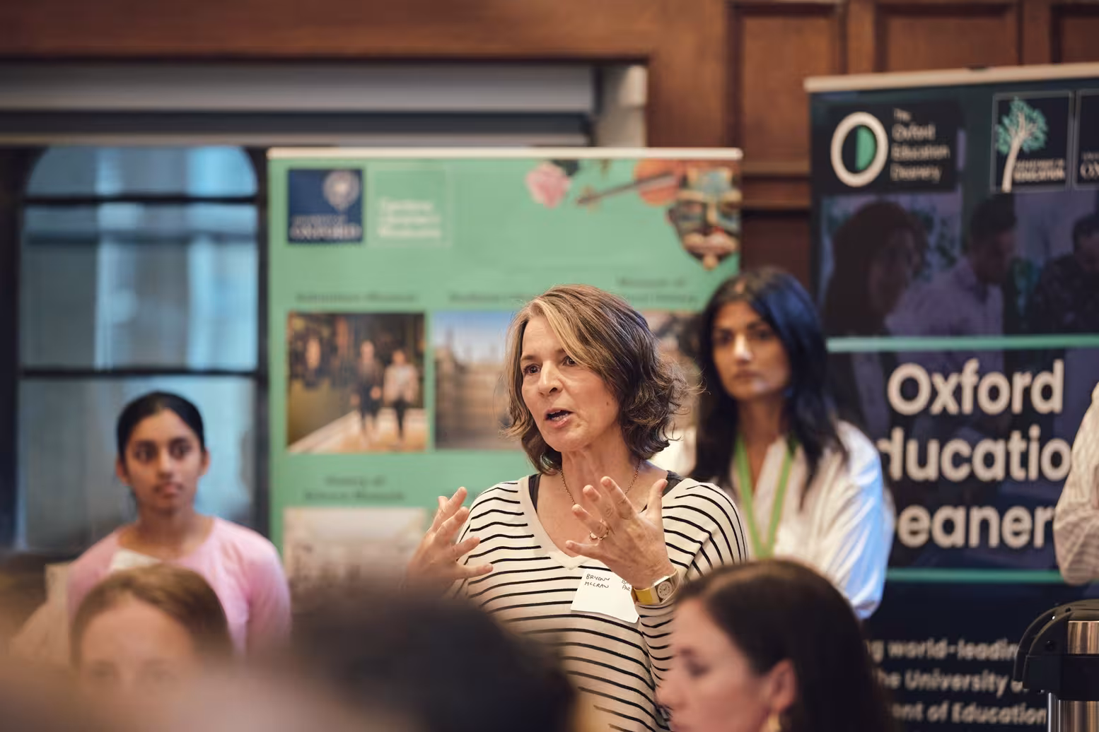 A teacher gestures during the Oxford Schools Guide launch.